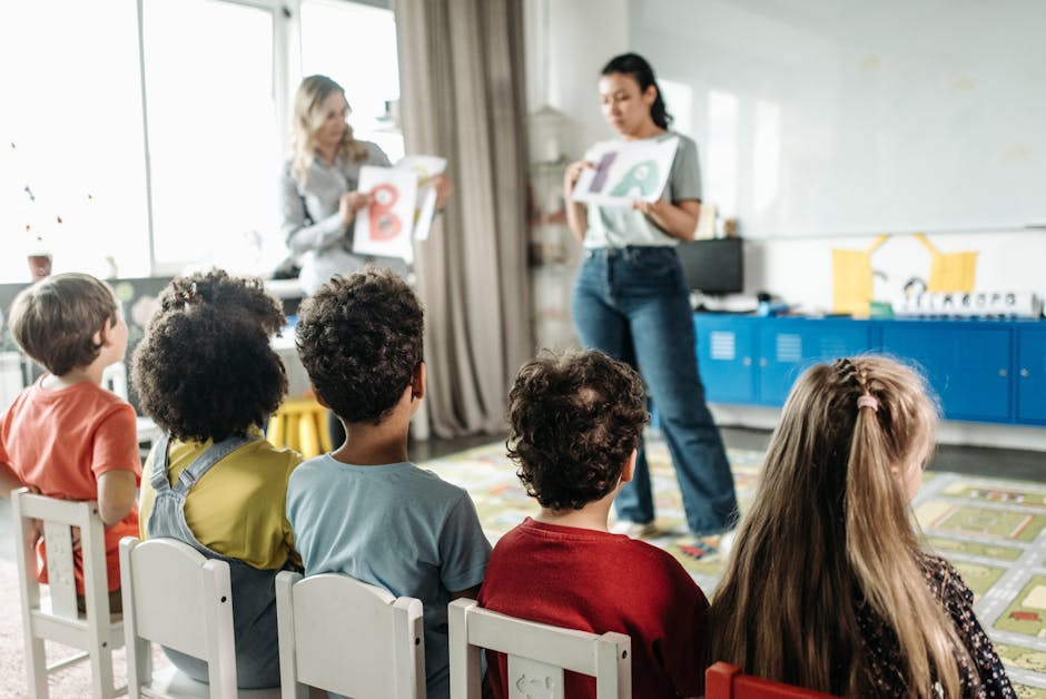 Children in a kindergarten classroom engaging with letters during a learning session
